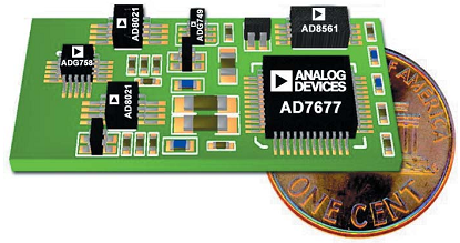 Figure 4. The dime shows the relative size of the complete data-acquisition system.